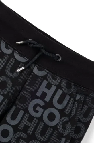 Kids’ cotton-blend tracksuit bottoms with all-over logo print