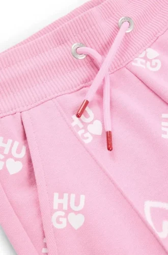 Kids’ cotton-blend tracksuit bottoms with logos and hearts Kids’ cotton-blend tracksuit bottoms with logos and hearts