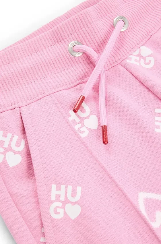 Kids’ cotton-blend tracksuit bottoms with logos and hearts Kids’ cotton-blend tracksuit bottoms with logos and hearts