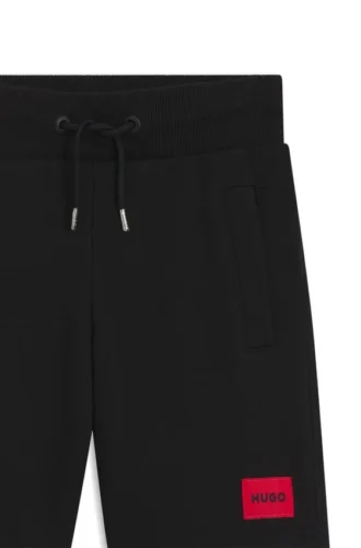 Kids’ fleece shorts with logo label