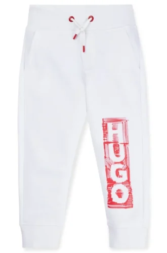 Kids’ fleece tracksuit bottoms with marker-style logo