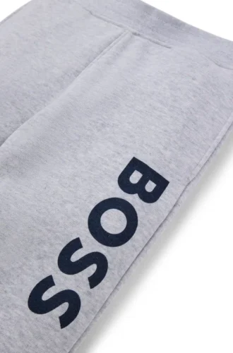 Kids’ fleece tracksuit bottoms with vertical logo print