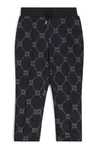 Kids’ loose-fit tracksuit bottoms with stacked-logo print