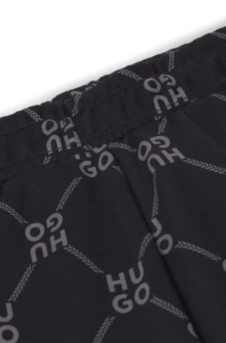 Kids’ loose-fit tracksuit bottoms with stacked-logo print Kids’ loose-fit tracksuit bottoms with stacked-logo print