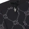 Kids’ loose-fit tracksuit bottoms with stacked-logo print