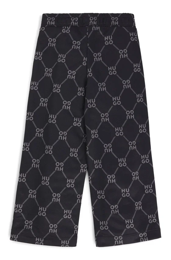 Kids’ loose-fit tracksuit bottoms with stacked-logo print Kids’ loose-fit tracksuit bottoms with stacked-logo print