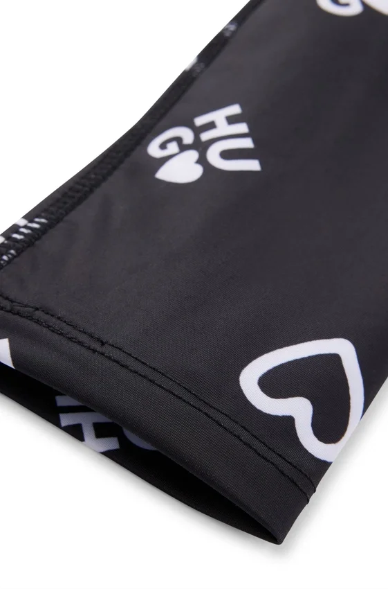 Kids’ stretch leggings with logo and hearts print Kids’ stretch leggings with logo and hearts print