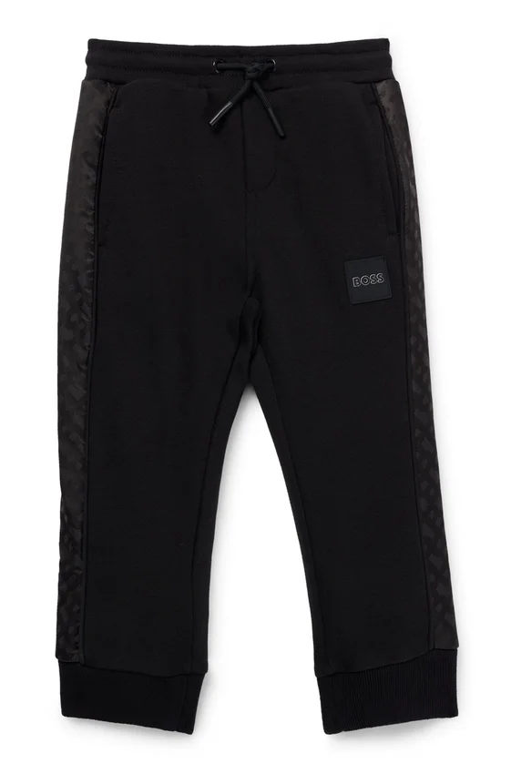 Kids’ tracksuit bottoms with monogram inserts Kids’ tracksuit bottoms with monogram inserts