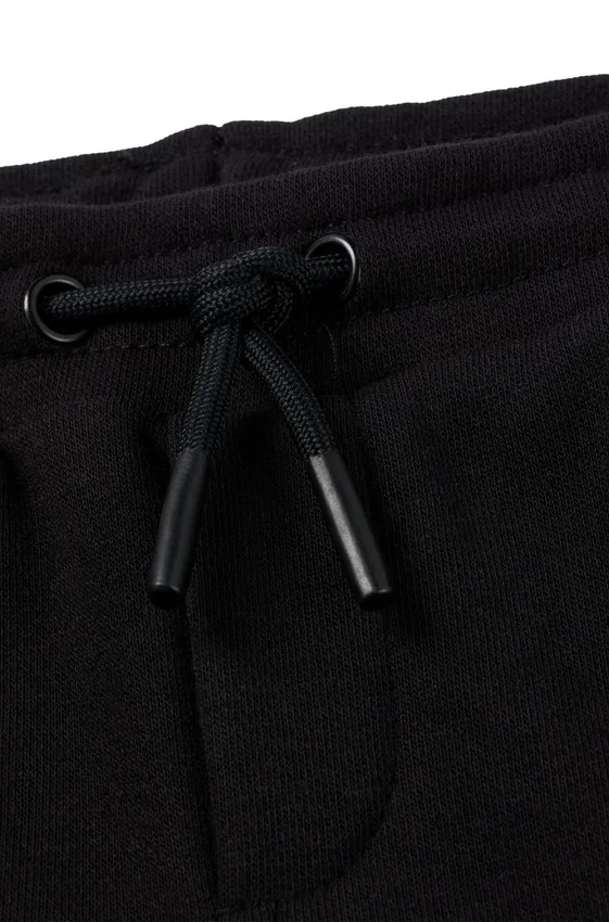 Kids’ tracksuit bottoms with monogram inserts Kids’ tracksuit bottoms with monogram inserts