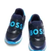 Kids’ trainers in leather and mesh with branded strap Kids’ trainers in leather and mesh with branded strap