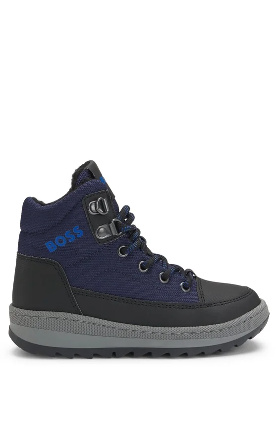 Kids’ water-repellent boots with faux-shearling lining Kids’ water-repellent boots with faux-shearling lining
