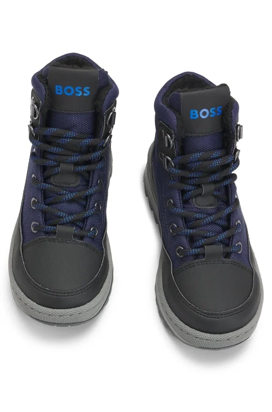 Kids’ water-repellent boots with faux-shearling lining Kids’ water-repellent boots with faux-shearling lining