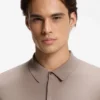 Knit polo sweater with covered placket