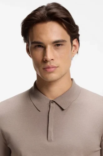 Knit polo sweater with covered placket