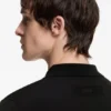 Knit polo sweater with covered placket