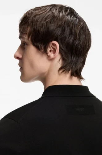 Knit polo sweater with covered placket
