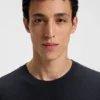 Knit sweater with mixed structures