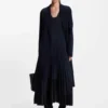 Knitted dress with plissé skirt part