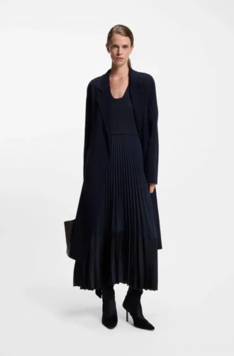 Knitted dress with plissé skirt part