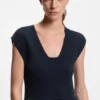 Knitted dress with plissé skirt part