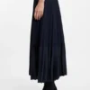 Knitted dress with plissé skirt part