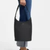 Leather bucket bag with metallic logo lettering