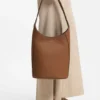 Leather bucket bag with metallic logo lettering