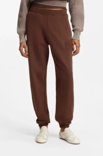 Logo-artwork tracksuit bottoms in cotton terry
