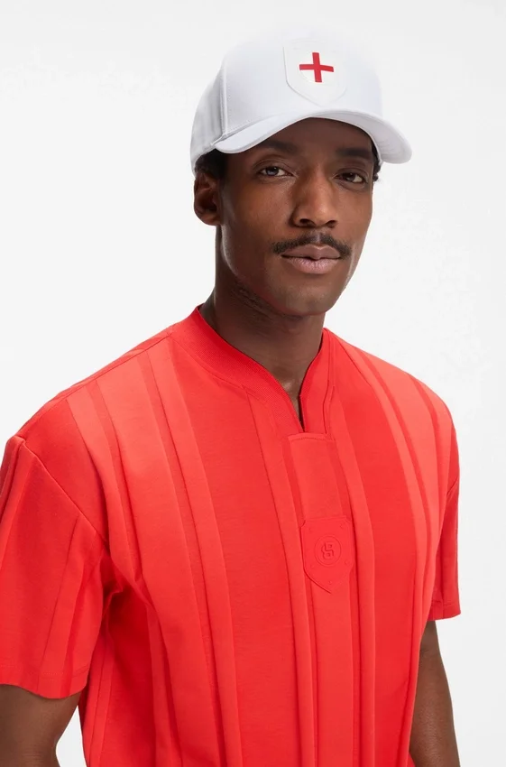 Logo cap in lustrous twill with country-flag badge Logo cap in lustrous twill with country-flag badge