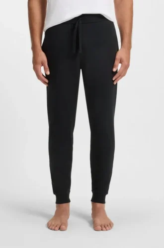 Logo-print tracksuit bottoms in cotton terry