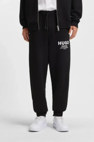 Logo-print tracksuit bottoms in cotton terry