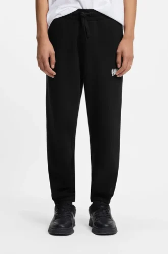 Logo-print tracksuit bottoms in cotton terry Logo-print tracksuit bottoms in cotton terry