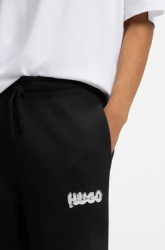 Logo-print tracksuit bottoms in cotton terry Logo-print tracksuit bottoms in cotton terry