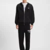 Logo-print tracksuit bottoms in cotton terry