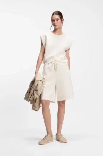 Loose-fit sweatshirt with V-cut hemline