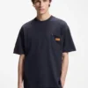 Loose-fit T-shirt in cotton with suede logo badge