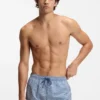 Micro-print swim trunks with logo patch