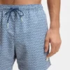 Micro-print swim trunks with logo patch