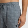 Micro-print swim trunks with logo patch