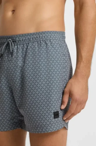 Micro-print swim trunks with logo patch
