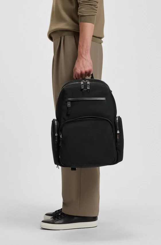 Multi-pocket backpack with leather trim Multi-pocket backpack with leather trim