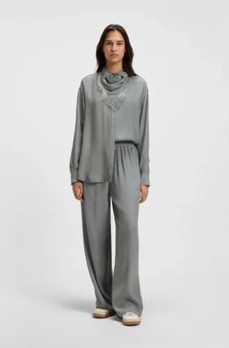 Oversized-fit blouse with fringing and logos