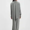 Oversized-fit blouse with fringing and logos