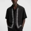Oversized-fit shirt with embroidered pattern