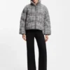 Padded jacket with houndstooth pattern