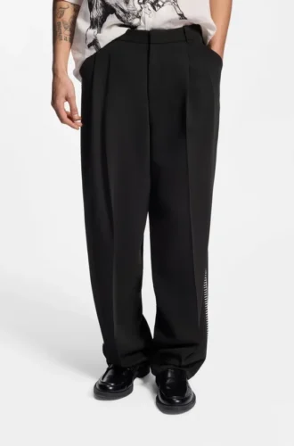 Pleat-front pants with whipstitch details