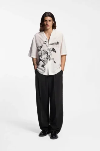 Pleat-front pants with whipstitch details