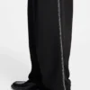 Pleat-front pants with whipstitch details