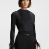 Plissé top with detachable feather cuff trims