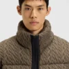 Puffer jacket with cable-knit structure Puffer jacket with cable-knit structure